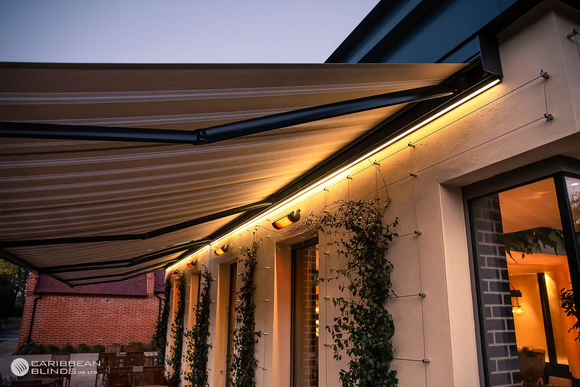 Awning with integrated LED strip lighting glowing at night